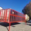 red cattle trailer on stands