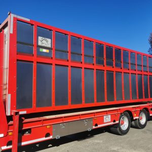 red low loader and cattle trailer