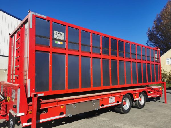 red low loader and cattle trailer